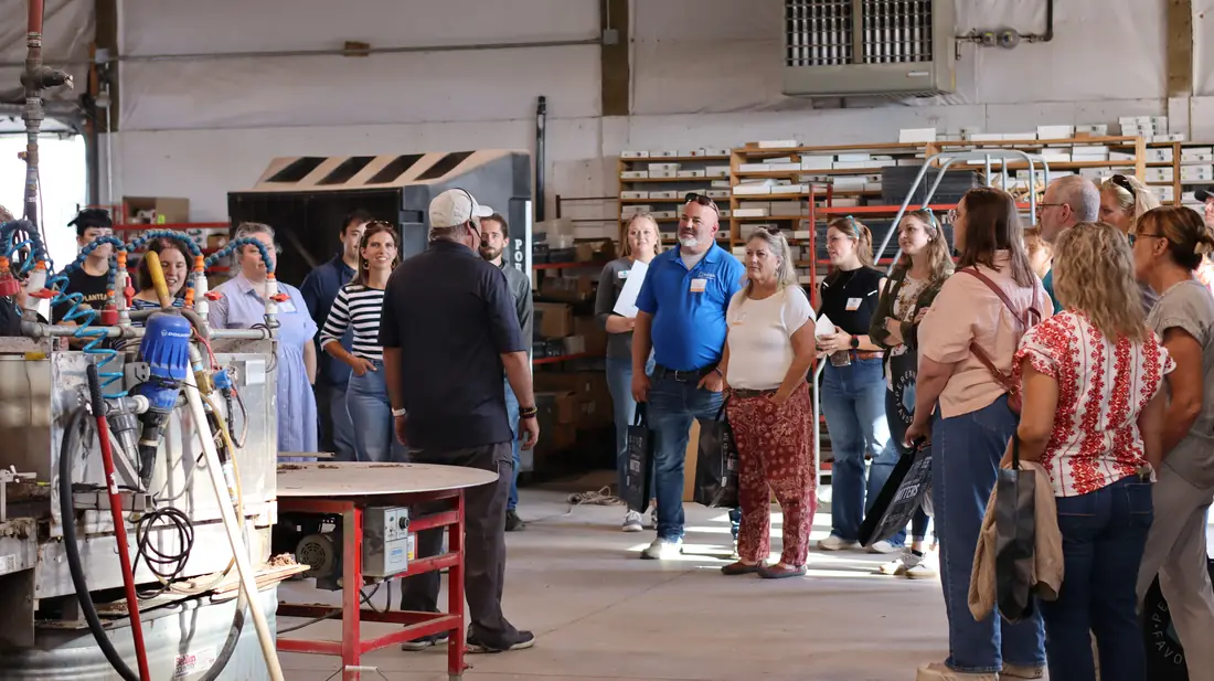 Tour group inside the production building