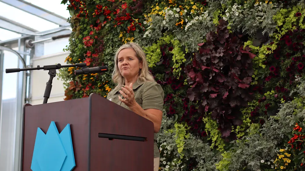 Cynthia Bee speaking at the podium