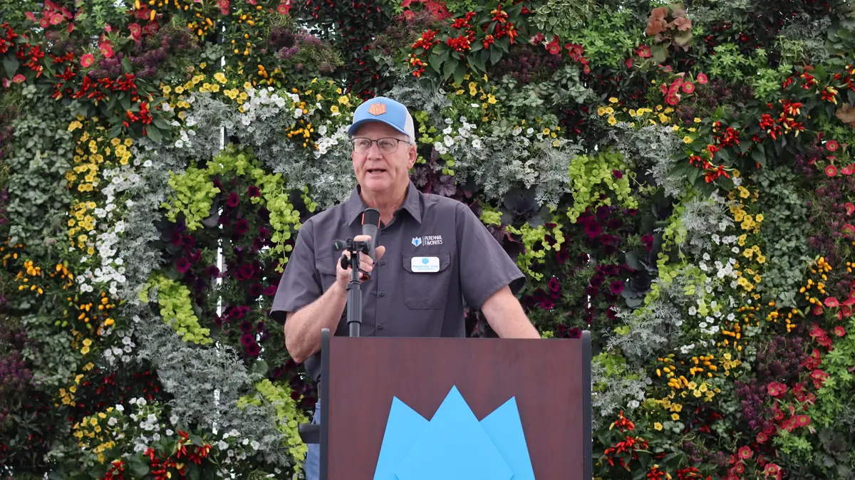 Preston Cox giving closing remarks at the podium