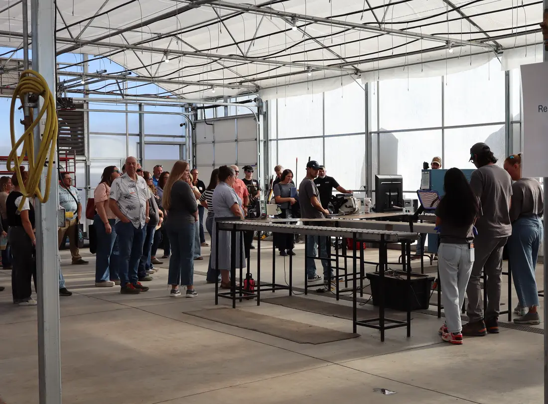 Guests around the packing tables in the Shipping House