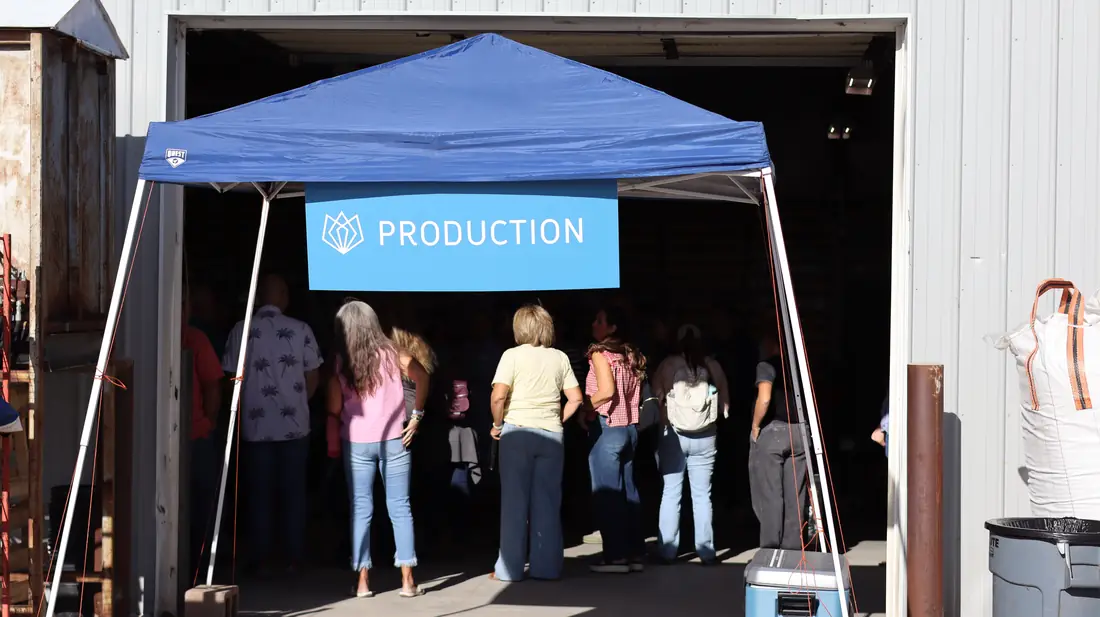 Production sign on a tent at the production building door